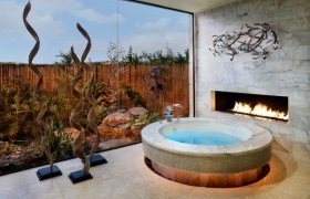 Cool bath tub design with an adjacent fireplace