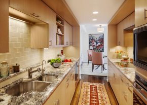 In this Cambridge kitchen, the fridge was placed below the counter.
