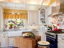Vintage butcher block makes for a unique island in the small traditional kitchen [From: Debra Campbell Design]